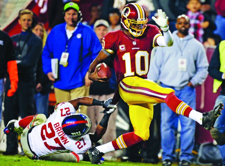 Evan Vucci/AP
Robert Griffin III broke free on a 46-yard run during the third quarter Monday. He finished with 72 yards rushing in the win.