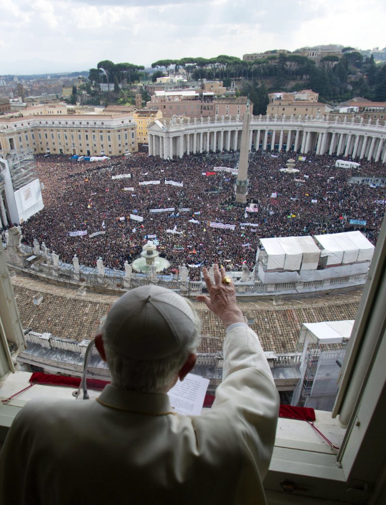 FILE -- In this photo from files taken on Feb. 24, 2013 and provided by the Vatican newspaper L'Osservatore Romano, Pope Benedict XVI delivers his blessing during his last Angelus noon prayer, from the window of his studio overlooking an overcrowded St. Peter's Square, at the Vatican. Planning for the moment when the next pope is proclaimed to the world, and for the installation ceremony a few days later, is a big-time guessing game. And that adds up to an ungodly logistical headache for the city of Rome. Nearly everything went smoothly for Benedict's last public appearances, although some faithful panicked during the retired pope's penultimate Sunday blessing from his studio window, when thousands of last-minute arrivals tried to squeeze through three narrow openings through a metal fence ringing the edge of the square. (AP Photo/L'Osservatore Romano, ho)