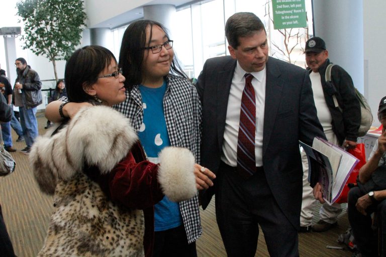 Ada Negovanna, left, and Jamen Negovanna, middle, both of Wainright, Alaska, pose with U.S. Sen. Mark Begich, D-Alaska, for a photo following a debate Friday, Oct. 24, 2014, in Anchorage, Alaska. Begich debated his opponent, GOP challenger Dan Sullivan, during the Alaska Federation of Natives convention ahead of the Nov. 4 general election. (AP Photo/Mark Thiessen)