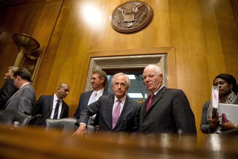 In this April 14, 2015 file photo, Senate Foreign Relations Committee Chairman Sen. Bob Corker, R-Tenn., center, speaks with the committee's ranking member Sen. Ben Cardin, D-Md., on Capitol Hill in Washington. (AP Photo/Andrew Harnik, File)