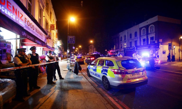 Police man a cordon at Finsbury Park where a vehicle struck pedestrians in London Monday, June 19, 2017. Police say a vehicle struck pedestrians on a road in north London, leaving several casualties and one person has been arrested. (Yui Mok/PA via AP)