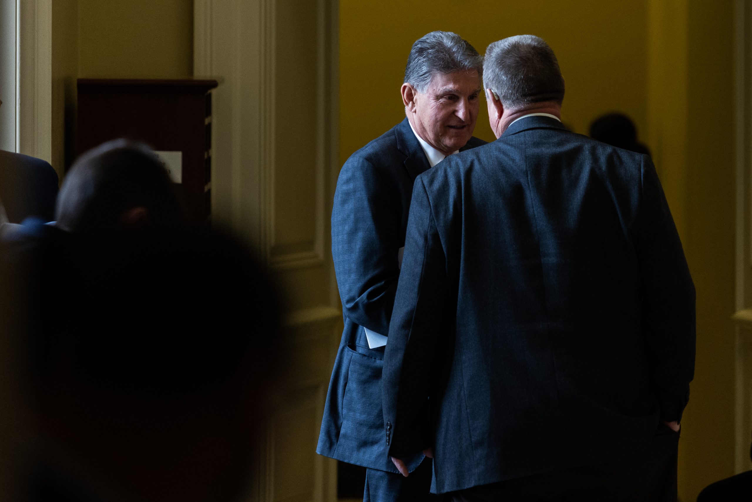 Sen. Joe Manchin, a Democrat from West Virginia, speaks with Sen. John Tester (D-MT) during the weekly Democratic caucus luncheon on Capitol Hill, on Tuesday, May 2, 2023. Manchin has pushed back on President Joe Biden's agenda regarding the debt ceiling. Lawmakers plan to meet with Biden next week to hash out bipartisan talks on a solution to the crisis. 

