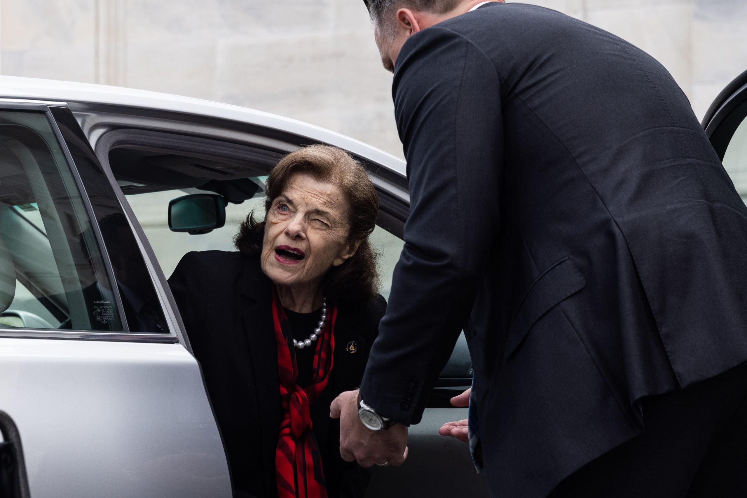 Sen. Dianne Feinstein (D-CA) is assisted to a wheelchair by staff as she returns to the Senate after a nearly three-month absence with shingles, at the Capitol, Wednesday, May 10, 2023. 