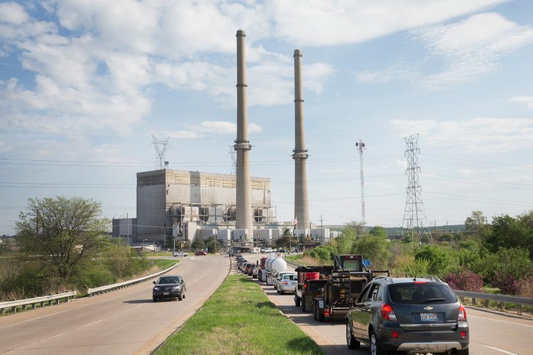 Traffic backs up at an intersecton in front of NRG Energy's Joliet Station power plant on May 7, 2015 in Joliet, Illinois. According to scientists, global carbon dioxide concentrations have reached a new monthly record of 400 parts per million, levels that haven't been seen for about two million years. (Photo by Scott Olson/Getty Images)