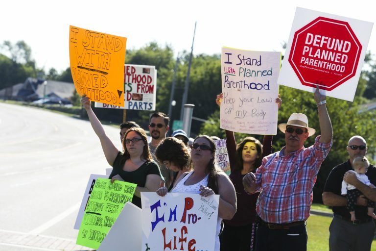 Anti-abortion activists protest in front of Planned Parenthood in Kalamazoo, Mich., on Saturday, Aug. 22, 2015. (Crystal Vander Weit/Kalamazoo Gazette-MLive Media Group via AP)