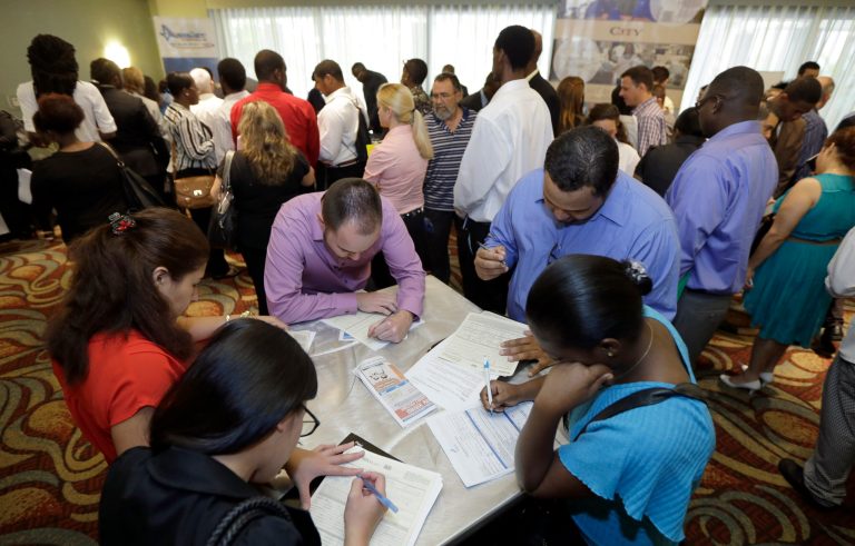 Job seekers attend a job fair in Miami Lakes, Fla.Â First-time claims for unemployment benefits rose to 316,000 for the week ending Jan. 10, the Department of Labor reported Thursday.Â (AP Photo/Alan Diaz)
