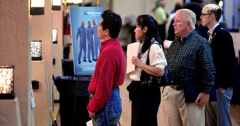 Job seekers wait in line to turn in their resumes at the Bayfront Health booth at the Tampa Bay Job and Career Fair at the Coliseum, Monday, April 14, 2014, in St. Petersburg, Fla. It was the first time Bayfront Health participated in the event. The event also included a Career Fair. Several of the area's top schools for continuing education, local universities and vocational/technical institutes participated. (AP Photo/The Tampa Bay Times, Cherie Diez)