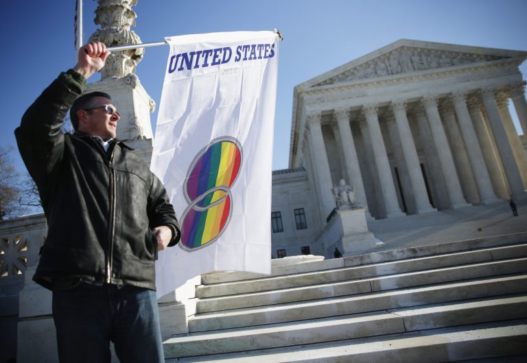 Pete Prete of Equality Beyond Gender holds a 'marriage pride flag' outside the U.S. Supreme Court January 9, 2015 in Washington, DC. (Photo by Alex Wong/Getty images)