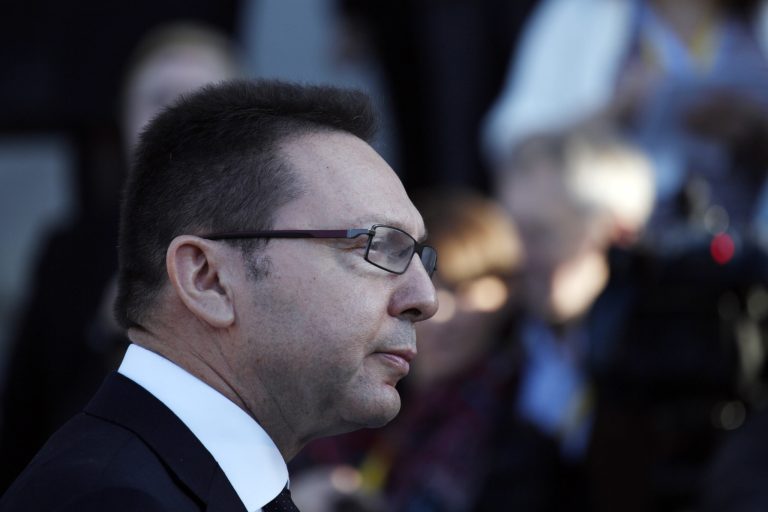 Greek Finance Minister Yannis Stournaras, speaks to reporters upon his arrival at Zappeion hall to attend a Eurogroup meeting, in Athens on Tuesday, April 1, 2014.  Finance ministers from the eurozone and the wider European Union are gathering in Athens amid tight security, with Greece hoping for a gesture of support for the release of long-delayed funds from the country's multi-billion-euro bailout. (AP Photo/Kostas Tsironis)