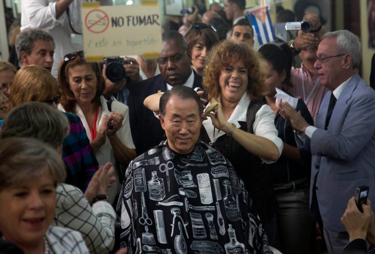 United Nations Secretary-General Ban Ki-moon, gets a haircut in a barbershop in Old Havana, Cuba, Monday, Jan. 27, 2014. Ban Ki-moon as well as leaders from Latin America and the Caribbean are arriving in Havana this weekend to participate in the Community of Latin American and Caribbean States, or CELAC summit. (AP Photo/Ramon Espinosa)