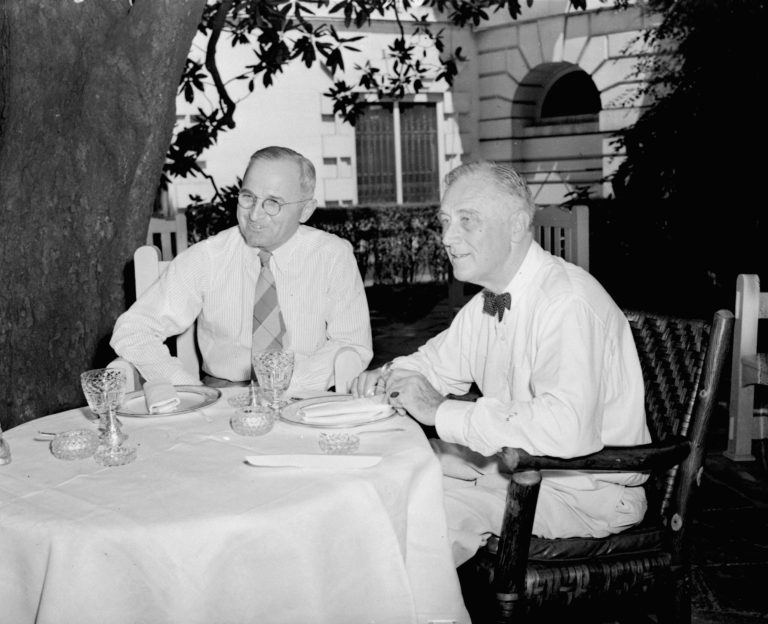 Meeting for the first time since their nominations, President Roosevelt and Harry S. Truman, Vice Presidential candidate, plan their campaigns as they lunch beneath a magnolia tree on the White House lawn August 18, 1944. (AP Photo/stf)