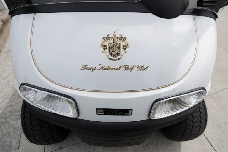 While some criticized Trump for driving on the green, others jumped to the president's defense pointing out that he owns the golf course. (AP Photo/Julio Cortez)