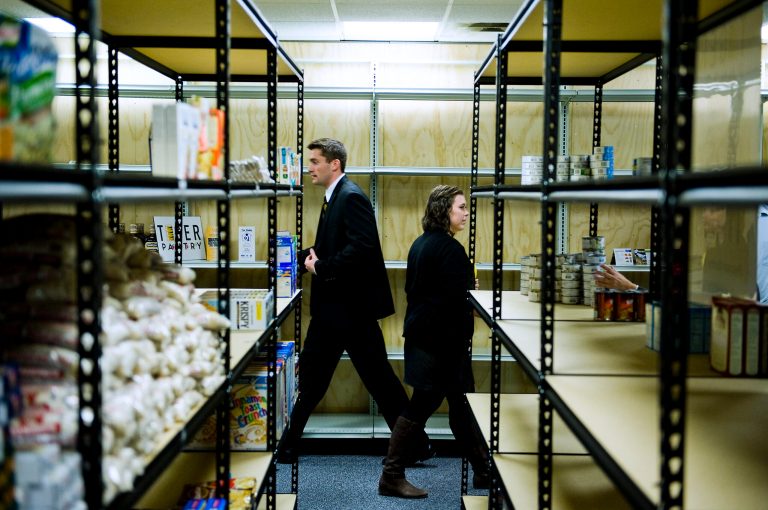   In this Oct. 1, 2012 photo, Nick Droege, left, founder of Tiger Pantry food pantry for students, and Amanda Gray, operations coordinator for Tiger Pantry, walk through the facility during an opening ceremony in Columbia, Mo. The food pantry will serve students in need of assistance in the Columbia area. (AP Photo/Columbia Daily Tribune, August Kryger)  