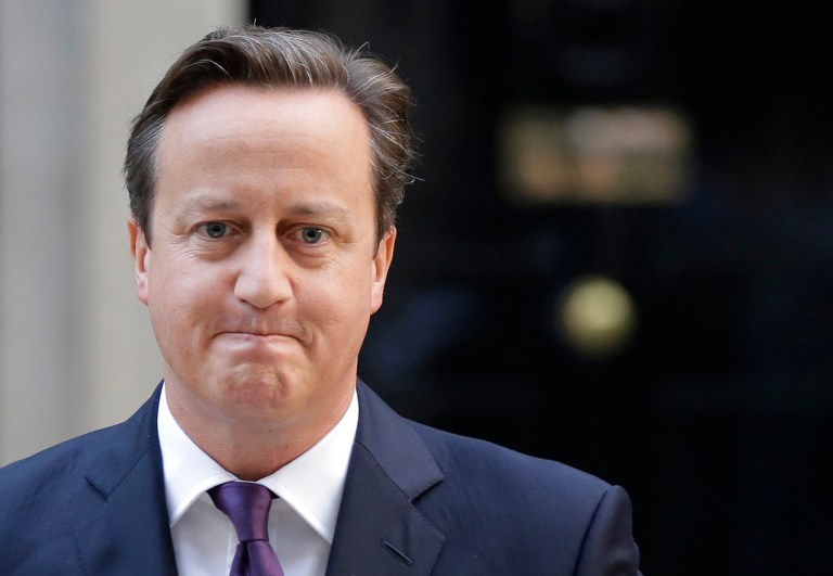 British Prime Minister David Cameron leaves after giving a statement to the media about Scotland's referendum results, outside his official residence at 10 Downing Street in central London,  Friday, Sept. 19, 2014. Scottish voters have rejected independence, deciding to remain part of the United Kingdom after a historic referendum that shook the country to its core. The decision prevented a rupture of a 307-year union with England, bringing a huge sigh of relief to the British political establishment. (AP Photo/Lefteris Pitarakis)