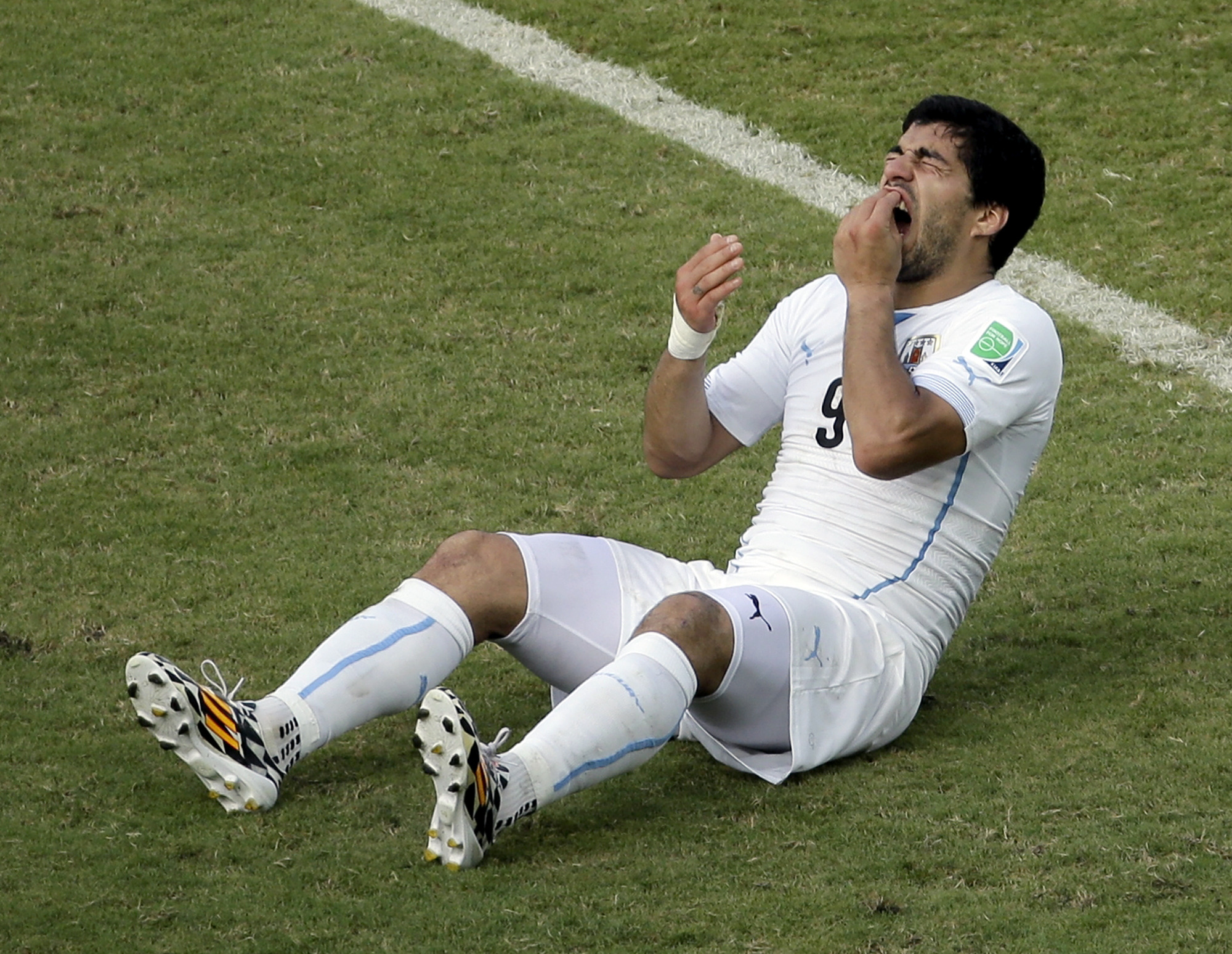 FIFA charges Luis Suarez for biting incident