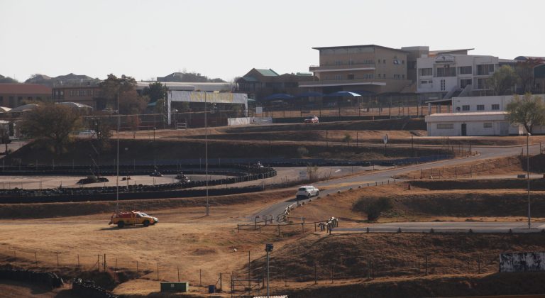 A partial view of the Kyalami race track is seen Thursday July 24, 2014 north of Johannesburg. The South African unit of sports car maker Porsche bought the Kyalami race track for $19.5 million at an auction easing concerns among racing enthusiasts that the winning bidder would tear up the track and build office or commercial buildings in its place. (AP Photo/Denis Farrell)