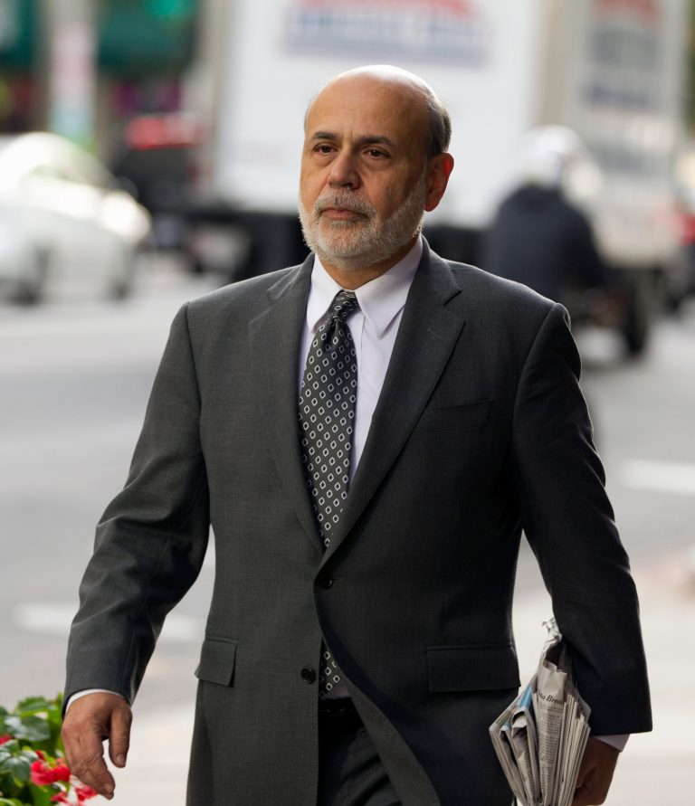 Former Federal Reserve Chairman Ben Bernanke arrives at the U.S. Court of Federal Claims in Washington, Thursday, Oct. 9, 2014, to testify in a suit on the US government's 2008 bailout of (AIG) American International Group Inc. in a trial of a lawsuit filed by the insurance giant's former CEO over the handling of the rescue.( AP Photo/Jose Luis Magana)