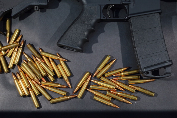MIAMI, FL - DECEMBER 18:  In this photo illustration, a Rock River Arms AR-15 rifle is seen with ammunition on December 18, 2012 in Miami, Florida. The weapon is similar in style to the Bushmaster AR-15 rifle that was used during a massacre at an elementary school in Newtown, Connecticut. Firearm sales have surged recently as speculation of stricter gun laws and a re-instatement of the assault weapons ban following the mass shooting.  (Photo illustration by Joe Raedle/Getty Images)