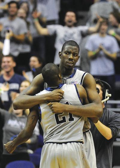 Richard Lipski/AP
Senior Henry Sims, back, leads the Hoyas with 3.6 assists a game, and senior Jason Clark averages a team-high 15.6 points a game.