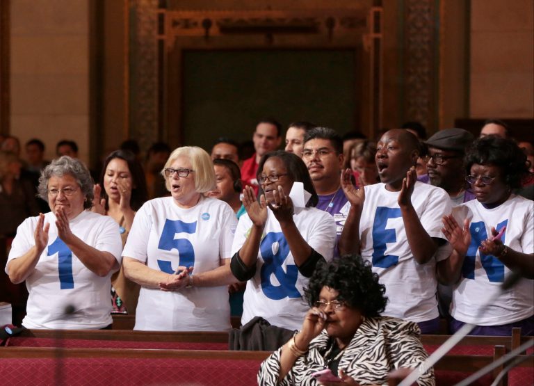 Supporters applaud during the minimum wage increase vote as the Los Angeles City Council votes to raise the minimum wage in the city to $15 an hour by 2020, making it the largest city in the nation to do so, in Los Angeles Tuesday, May 19, 2015. (AP Photo/Damian Dovarganes )