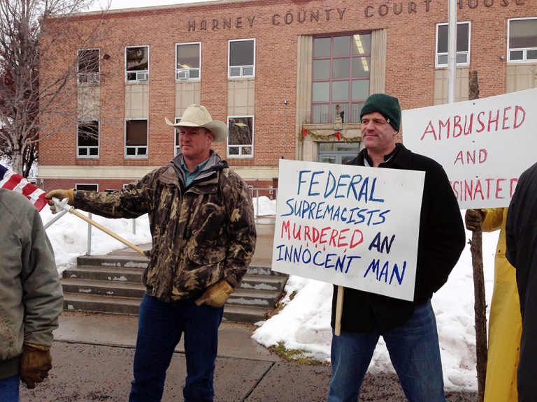 Protesters stand in front of the Harney County Courthouse in Burns, Ore., Friday, Jan. 29, 2016. (AP Photo/Nicholas K. Geranios)