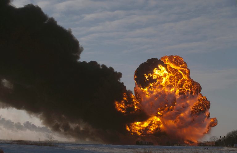 FILE - In this Dec. 30, 2013 file photo, a fireball goes up at the site of an oil train derailment in Casselton, N.D. Warning that a 
