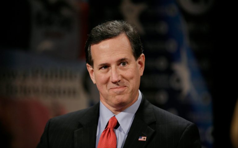 Former Pennsylvania Sen. Rick Santorum sits on the set of Iowa Press before taping at the Iowa Public Television studios in Johnston, Iowa. (AP Photo/Charlie Neibergall)