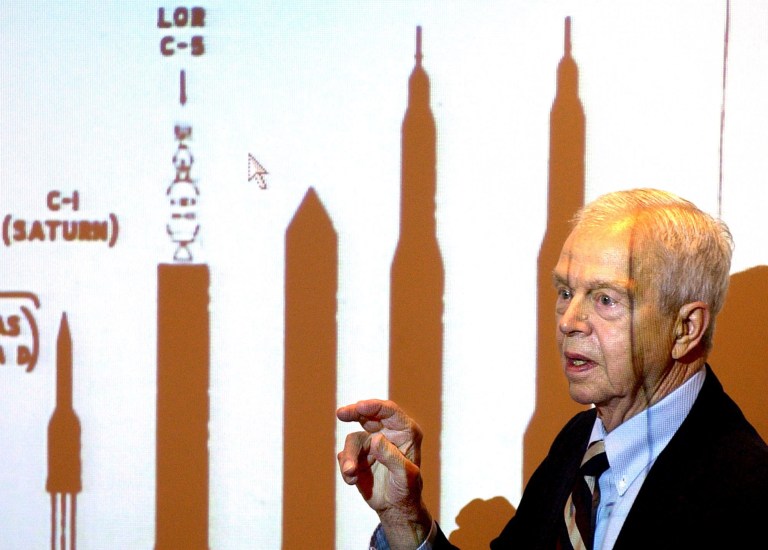 File-This Oct. 9, 2003, file photo shows John C. Houbolt explaining the size of different rockets required to launch various methods for landing on the moon at Grainger Engineering Library in Urbana, Ill. Houbolt, an engineer whose contributions to the U.S. space program were vital to NASA's successful moon landing in 1969, has died. He was 95. Houbolt's family confirmed his death Tuesday, April 15, 2014, at a Maine nursing home of complications from Parkinson's disease. (AP Photo/News-Gazette, John Dixon, File)