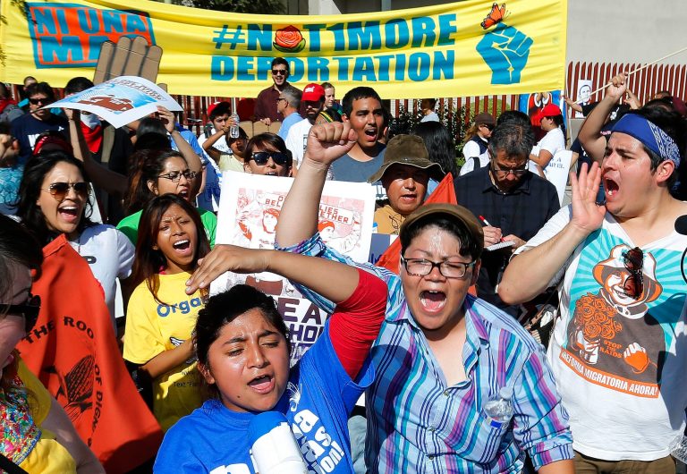 About 250 people immigration rights protesters chanting 