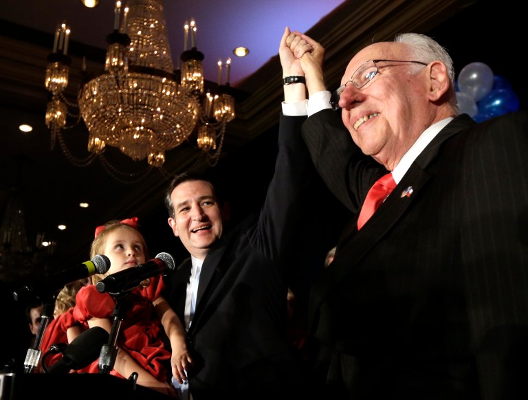 Republican candidate for U.S. Senate Ted Cruz, left, raises his hand with his father Rafael, right, while holding his daughter Caroline during a victory speech Tuesday, Nov. 6, 2012, in Houston. (AP Photo/David J. Phillip)