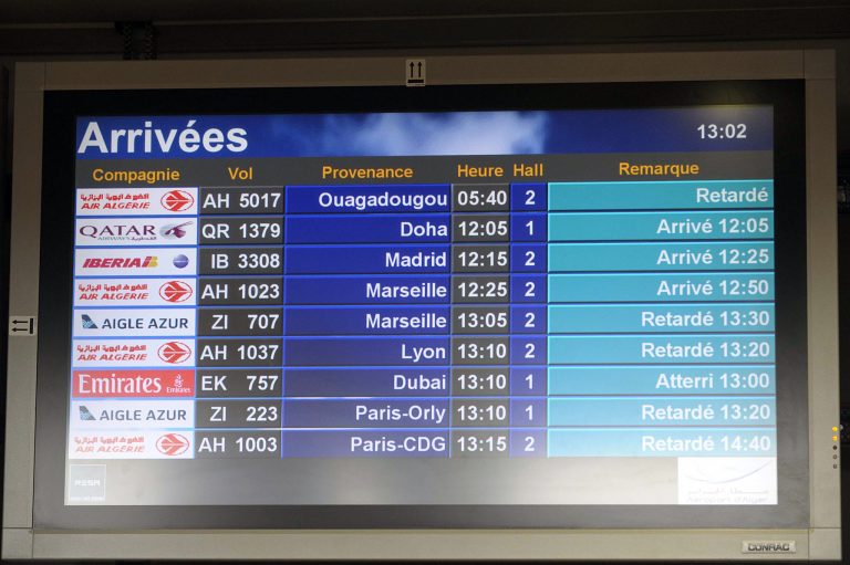 An arrival information screen shows the delayed Air Algerie flight 5017 (top) at the Houari Boumediene airport near Algiers, Algeria, Thursday, July 24, 2014. An Air Algerie flight carrying 116 people from Burkina Faso to Algeria's capital disappeared from radar early Thursday over northern Mali and 