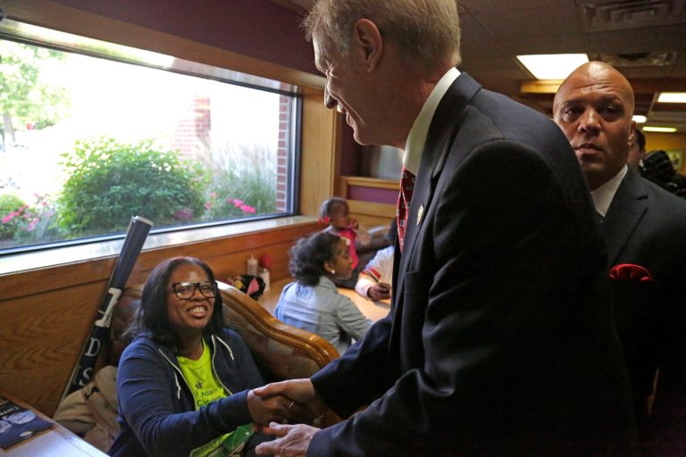 Illinois Republican gubernatorial candidate Bruce Rauner shakes a supporter's hand at an event where he was endorsed by a group of African American ministers Monday, Sept. 22, 2014, in Chicago. Rauner is running against Democratic Gov. Pat Quinn in the November general election. (AP Photo/M. Spencer Green)