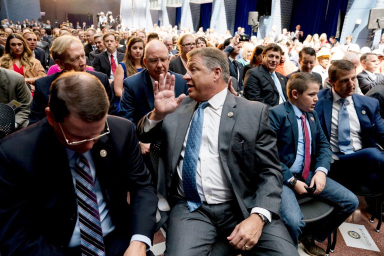 Rep. Bill Shuster, R-Pa., center, sits in the audience before President Trump speaks at a roundtable on infrastructure at the Department of Transportation, on June 9 in Washington. Shuster and outside advocates say the White House and Trump's Department of Transportation remain engaged in pursuing air traffic control privatization. (AP Photo/Andrew Harnik)