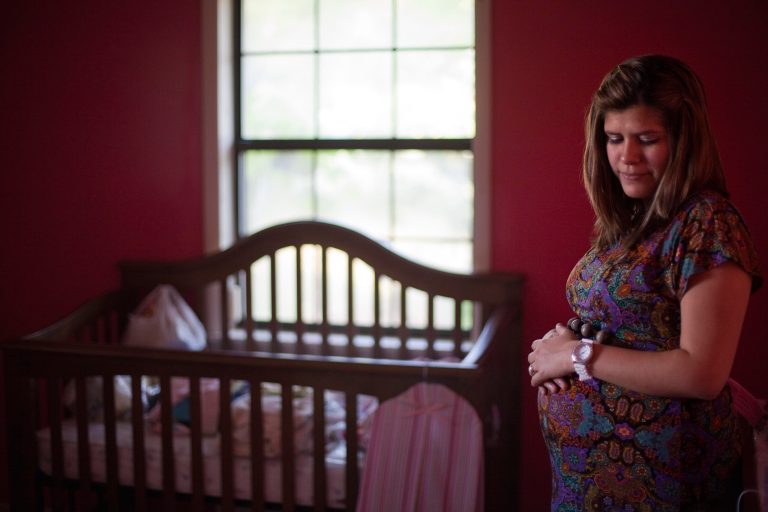 In this May 9, 2011 photo, Sandra Almanza, 20, stands in the room she and her husband just finished painting for their unborn daughter in their home in Lyons, Ga. (AP Photo/David Goldman)