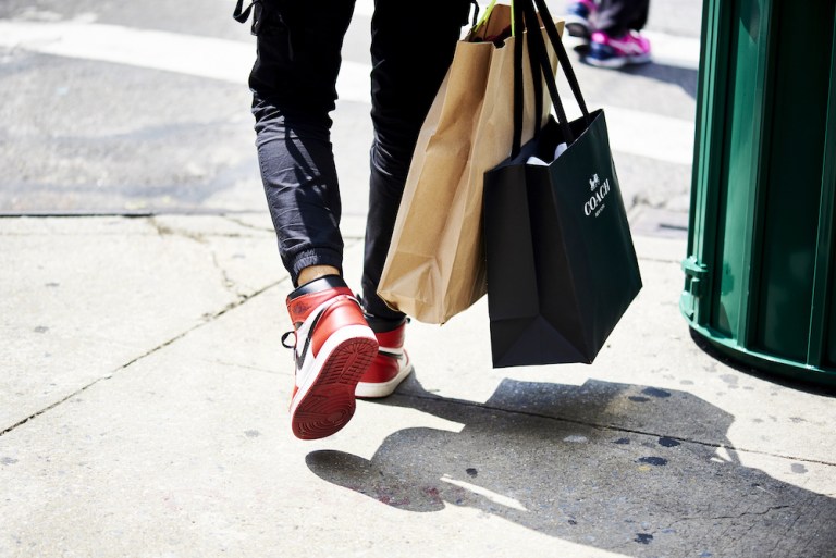 A shopper carries a Coach retail bag in New York's SoHo neighborhood. Coach parent Tapestry Inc. is monitoring the effects of President Trump's tariffs on Chinese imports, which analysts say will hurt retail-industry profits.