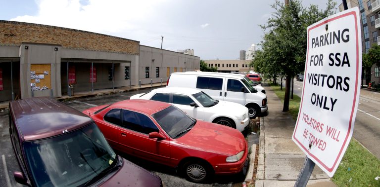 A parking sign for the former Social Security Administration office is seen in Houston, Wednesday, June 18, 2014. Budget cuts have forced the Social Security Administration to close dozens of field offices even as millions of baby boomers approach retirement, swamping the agency with applications for benefits, a senior agency official told Congress Wednesday. Better Internet access and more online services are easing the transition, said Nancy Berryhill, the agency's deputy commissioner for operations. (AP Photo/David J. Phillip)