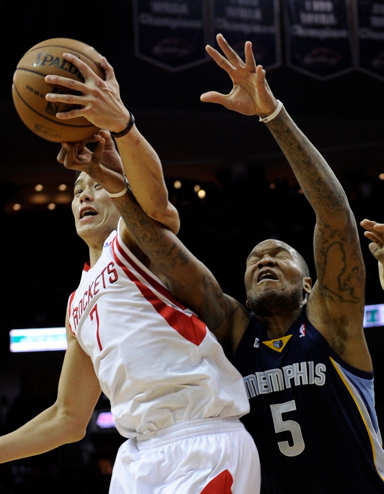   Houston Rockets' Jeremy Lin (7) knocks the ball away from Memphis Grizzlies' Marreese Speights (5) in the first half of an NBA basketball game on Saturday, Dec. 22, 2012, in Houston. (AP Photo/Pat Sullivan)  