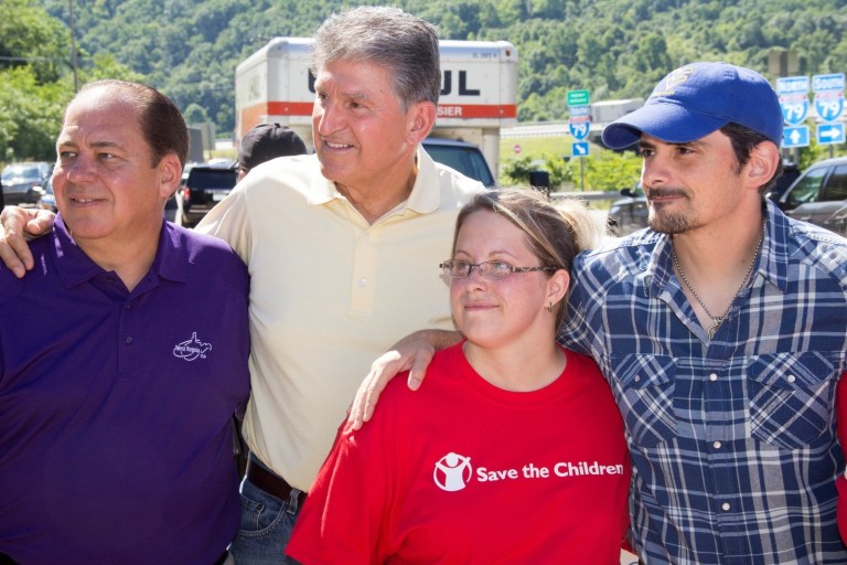Nonprofit group Save the Children led Brad Paisley and U.S. senators Joe Manchin and Shelley Moore Capito on a tour of the hardest-hit towns. (Save the Children)