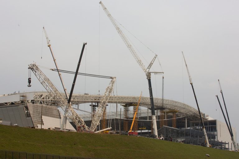 Construction cranes skirt the Itaquerao stadium in Sao Paulo, Brazil, Wednesday, April 9, 2014. The stadium is slated to host the World Cup opener match between Brazil and Croatia on June 12. About 20,000 temporary seats are being installed behind the goals to increase the stadium's capacity to nearly 70,000. (AP Photo/Andre Penner)