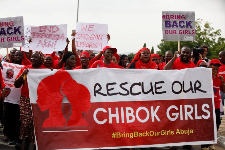 People attend a demonstration calling on the government to rescue the kidnapped girls of the government secondary school in Chibok, in Abuja, Nigeria, Thursday, May 22, 2014. Scores of protesters chanting 