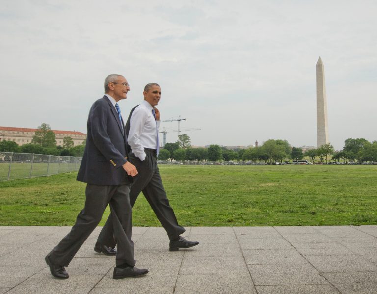 President Barack Obama and White House counselor John Podesta, left, walk across the ellipse in Washington as they head towards the Dept. of Interior, Wednesday, May 21, 2014. Obama and Podesta also walked back to the White House after a signing a proclamation regarding the Organ Mountains-Desert Peaks National Monument. (AP Photo/Pablo Martinez Monsivais)