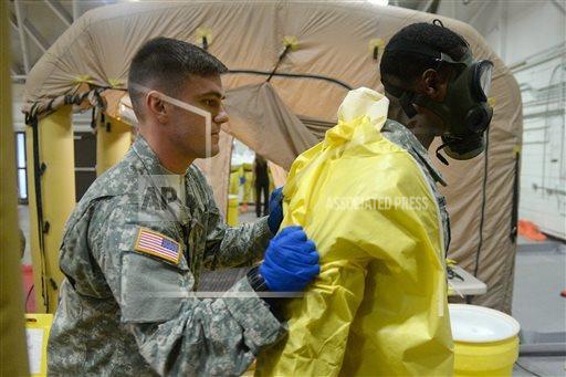 Members of the Army's 101st Airborne Division conduct a training exercise at Ft. Campbell, Ky., Thursday, Oct. 9, 2014. Members will travel to Liberia to build treatment centers and conduct medical training as part of the fight against the Ebola epidemic. (AP Photo/The Courier-Journal, Stephen Lance Dennee)