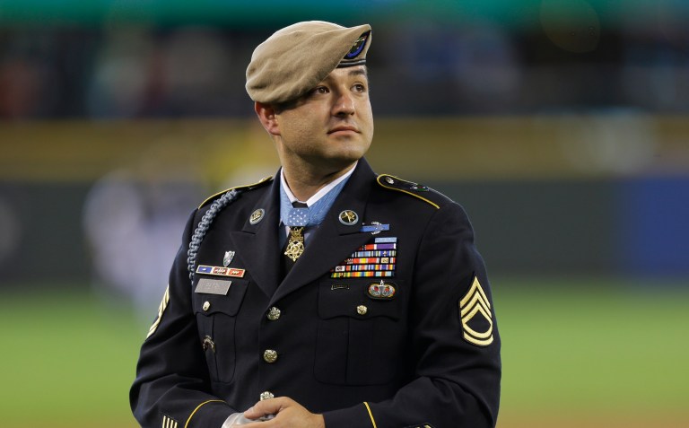 More than a dozen Medal of Honor recipients publicly endorsed Donald Trump on Monday, including U.S. Army Sgt. Leroy Petry, who lost his right hand in 2008 while serving in Afghanistan. (AP Photo/Ted S. Warren)