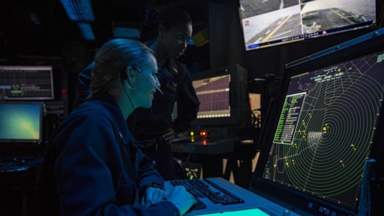 Air Traffic Controller 1st Class Brittni Latterell and Air Traffic Controller Chief Ayanna Gregg man the marshall control aboard the amphibious assault ship USS Wasp, currently underway conducting anti-submarine warfare training in support of Exercise Black Widow.