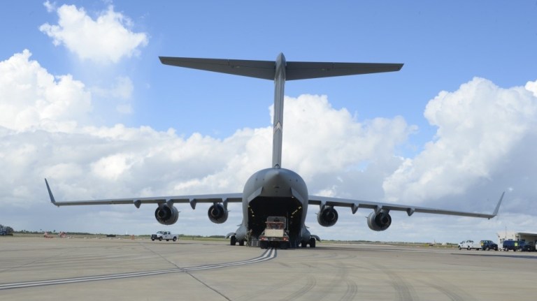 A truck backs out of a C-17 Globemaster III aircraft during Exercise Alamo Express at Corpus Christi Naval Air Station, Sept. 16, 2016. 