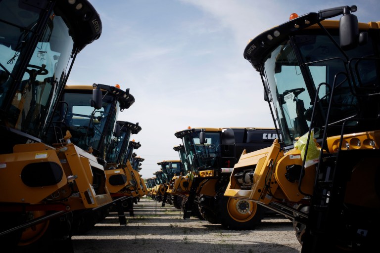 Combine harvesters sit parked before shipment at the CLAAS of America Inc. production facility in Omaha, Nebraska, U.S., on Wednesday, June 6, 2018. The Federal Reserve is scheduled to release industrial production figures on June 15. 