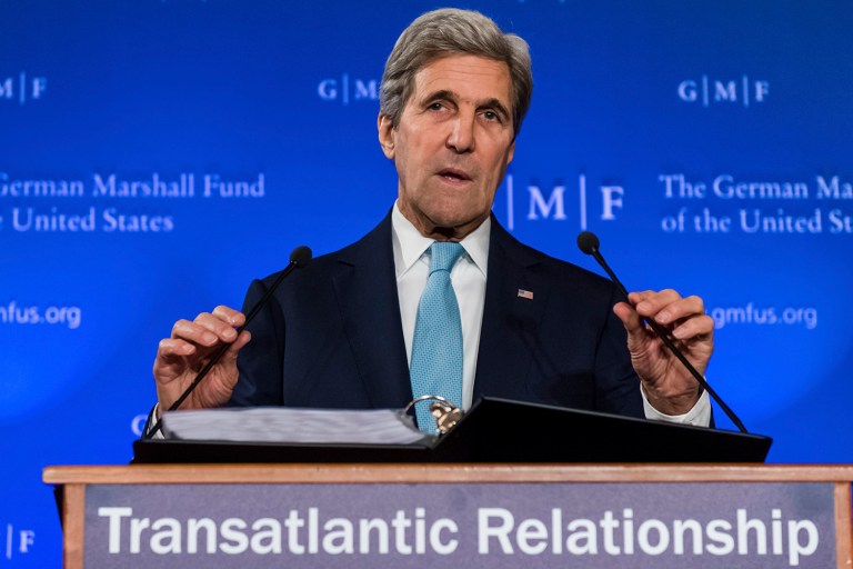 Secretary of State John Kerry saluted German Chancellor Angela Merkel for welcoming thousands of refugees into her country. (AP Photo/Geert Vanden Wijngaert)