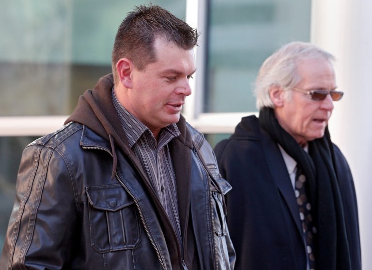 Eric Jensen, 37,  leaves the federal courthouse in Denver on Tuesday, Jan. 28, 2014, with attorney Forrest Lewis after he and his brother Ryan were sentenced to five years of probation and six months of home detention. The two Colorado cantaloupe farmers who pleaded guilty to misdemeanor charges stemming from a deadly listeria outbreak in 2011 were also ordered to each pay $150,000 in restitution and perform 100 hours of community service.(AP Photo/Ed Andrieski)