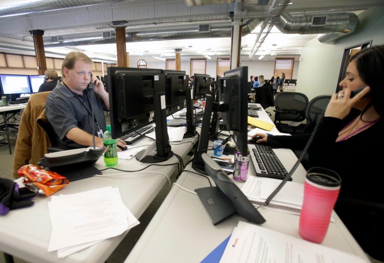 Guides work the phone bank at MnSure, Minnesota's insurance marketplace,  in St. Paul, Minn., on Dec. 31. (AP Photo/Jim Mone)