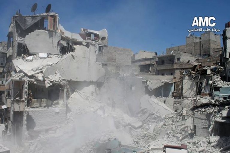 This photo provided by the anti-government activist group Aleppo Media Center (AMC), which has been authenticated based on its contents and other AP reporting, shows buildings which were destroyed from a Syrian government airstrike in Aleppo, Syria, Saturday, May. 17, 2014. The United Nations chief has condemned a cut in water supplies in the northern Syrian city of Aleppo that he said has deprived at least 2.5 million people of access to potable water. (AP Photo/Aleppo Media Center AMC)